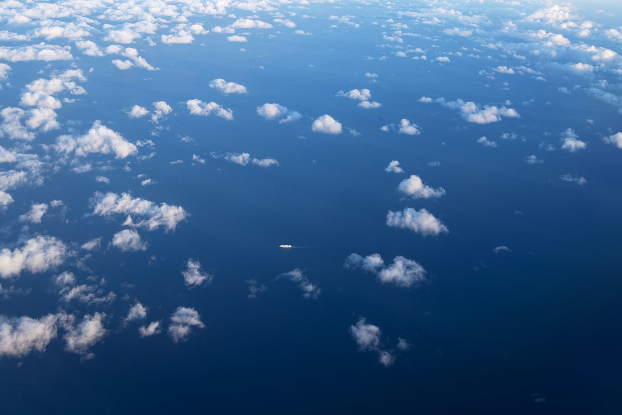 Rare white small clouds in a blue sky. Copy space